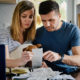 Man and woman checking payment bills