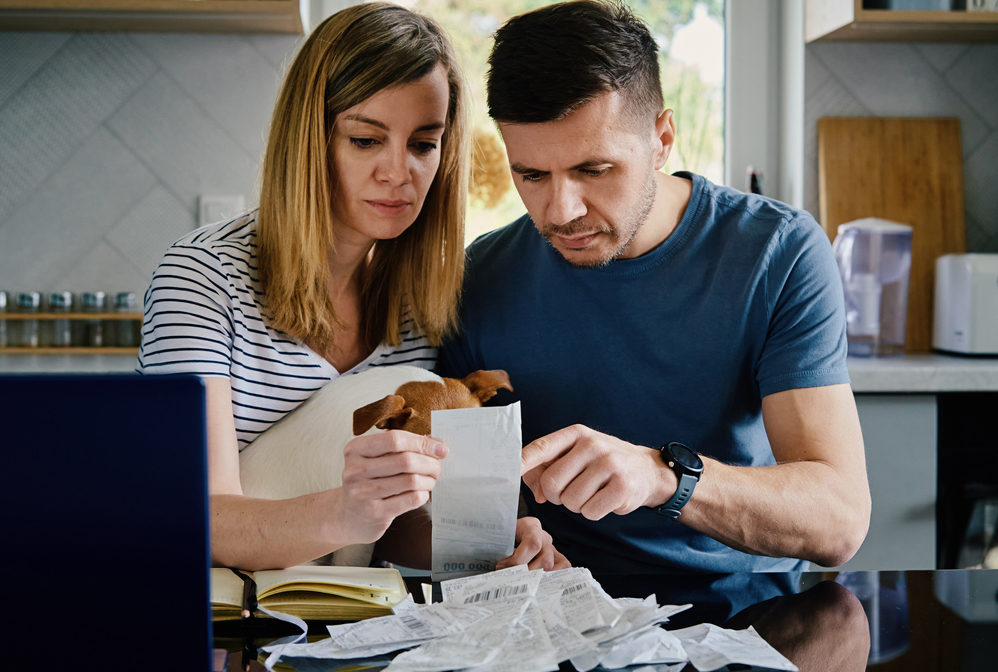 Man and woman checking payment bills