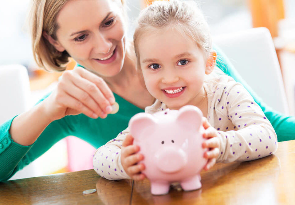 Mother helping child save money