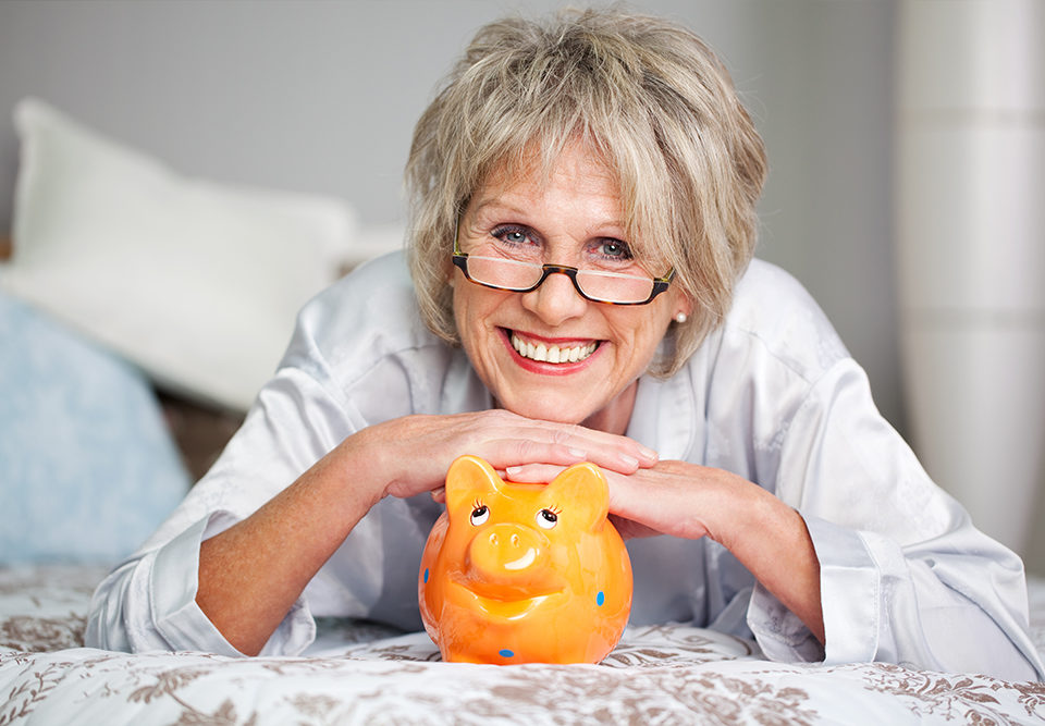 Happy older woman with retirement savings