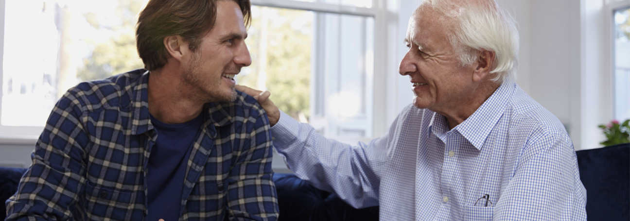 Adult son talking to father selling structured settlements for cash