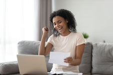 happy woman receives money for college