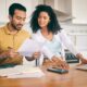 couple reviewing costs associated with selling structured settlement