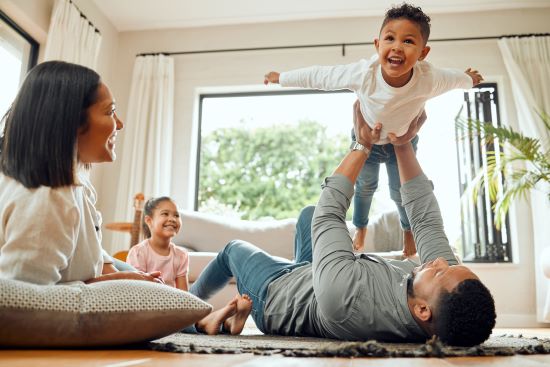 happy married couple enjoying time with kids