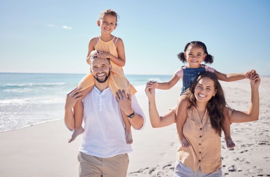 family after selling structured settlement enjoy walking on beach