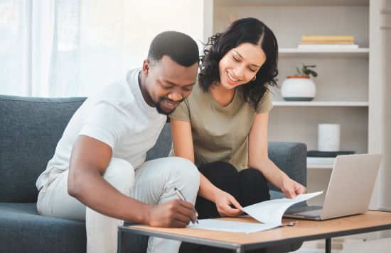 happy couple preparing to sell their structured settlement payments