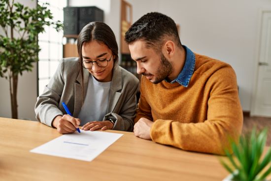 Couple reviewing details before selling their structured settlement payments