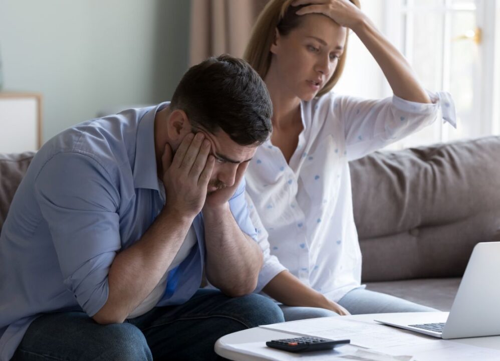 young couple dealing with financial stress