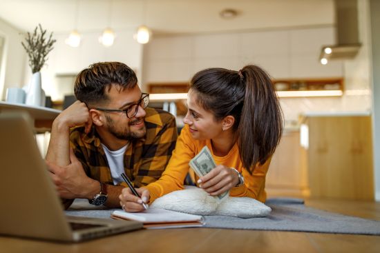 happy couple working towards financial stability