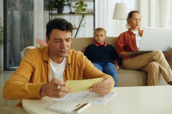 stressed family living in debt trying to find ways to pay off bills