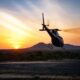 A helicopter flying into the sunset, symbolizing the tragic accident central to Vanessa Bryant's lawsuit settlement.