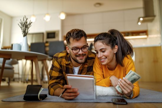 Couple planning finances with cash from a structured settlement buyout.