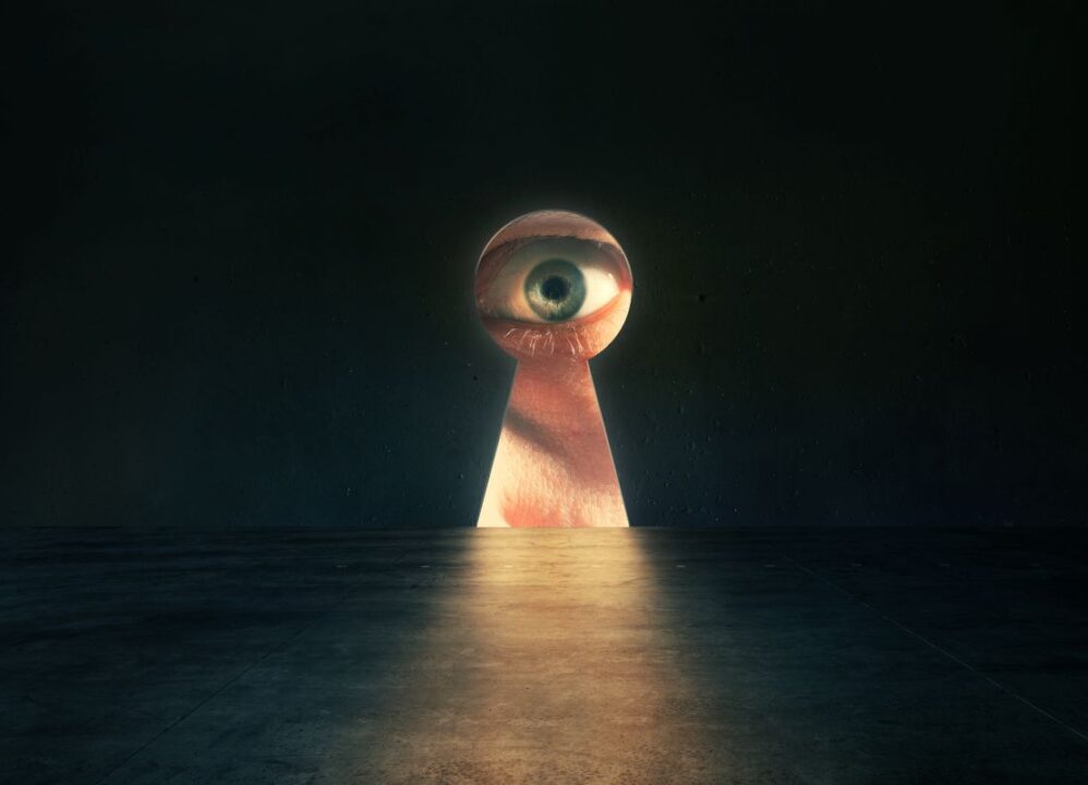 An intrusive eye peeking through a keyhole, symbolizing breaches of privacy and surveillance concerns, as highlighted by the Erin Andrews lawsuit.